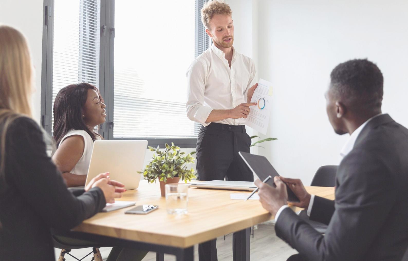 Small business owner analyzing financial reports and planning cash flow management strategies